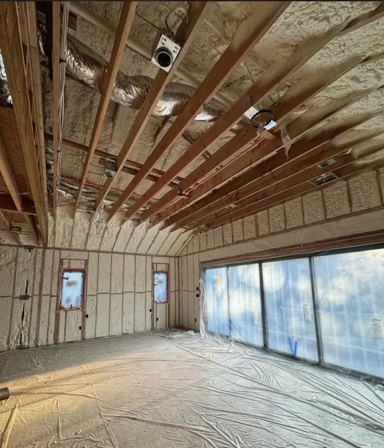 Interior walls and ceiling insulated with spray foam during new construction in Martin